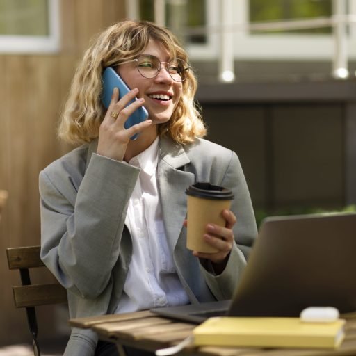 smiley-woman-talking-phone-medium-shot